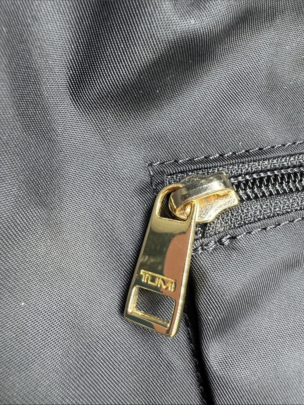 TUMI voyager just in case backpack packable black gold nylon travel neutral